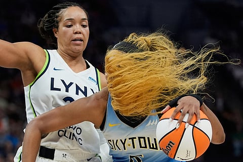 Chicago Sky forward Angel Reese, right, works toward the basket as Minnesota Lynx forward Napheesa Collier defends during the second half of a WNBA basketball game, July 22, 2025, in Minneapolis. 