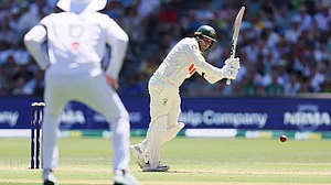 | Photo: AP/James Elsby : Australia's Usman Khawaja plays a shot during play on day one of the third Ashes Test on December 17, 2025.