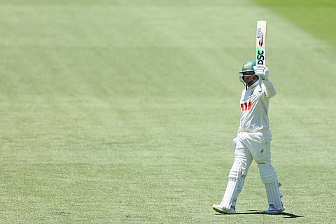 Australia's Usman Khawaja celebrates his fifty runs during play on day one of the third Ashes cricket test between England and Australia at the Adelaide Oval in Adelaide, Australia.
