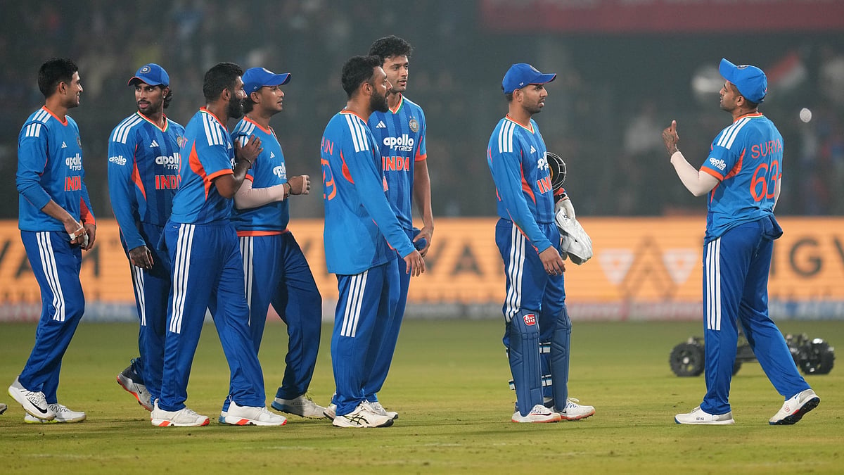 | Photo: AP/Rafiq Maqbool : India's captain Suryakumar Yadav with teammates celebrates after winning the first T20I match against South Africa on December 9, 2025.
