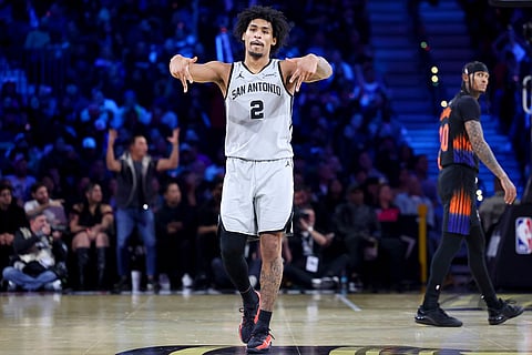 San Antonio Spurs guard Dylan Harper (2) reacts after making a 3-point basket against the New York Knicks during the second half of the NBA Cup championship basketball game in Las Vegas.