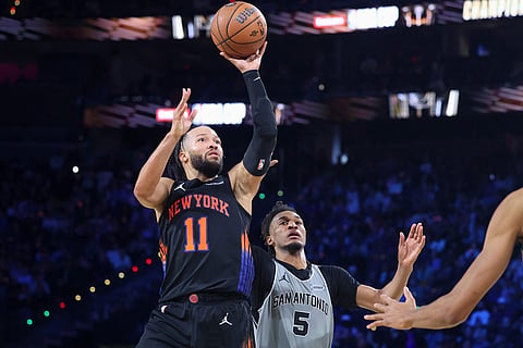 New York Knicks guard Jalen Brunson (11) shoots against San Antonio Spurs guard Stephon Castle (5) during the second half of the NBA Cup championship basketball game in Las Vegas.