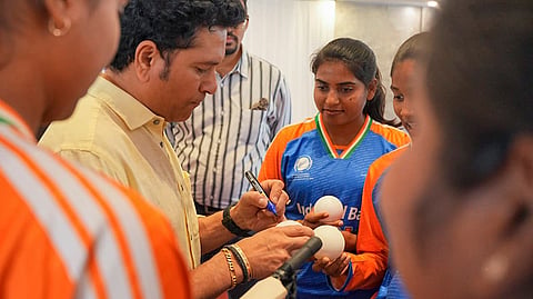 Cricket legend Sachin Tendulkar gives autographs to the Indian Women’s Blind Cricket Team members, at the MIG Cricket Club, in Mumbai. 