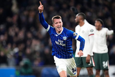 Cardiff City's David Turnbull celebrates scoring their side's first goal of the game against Chelsea during the English League Cup quarterfinal soccer match in Cardiff.