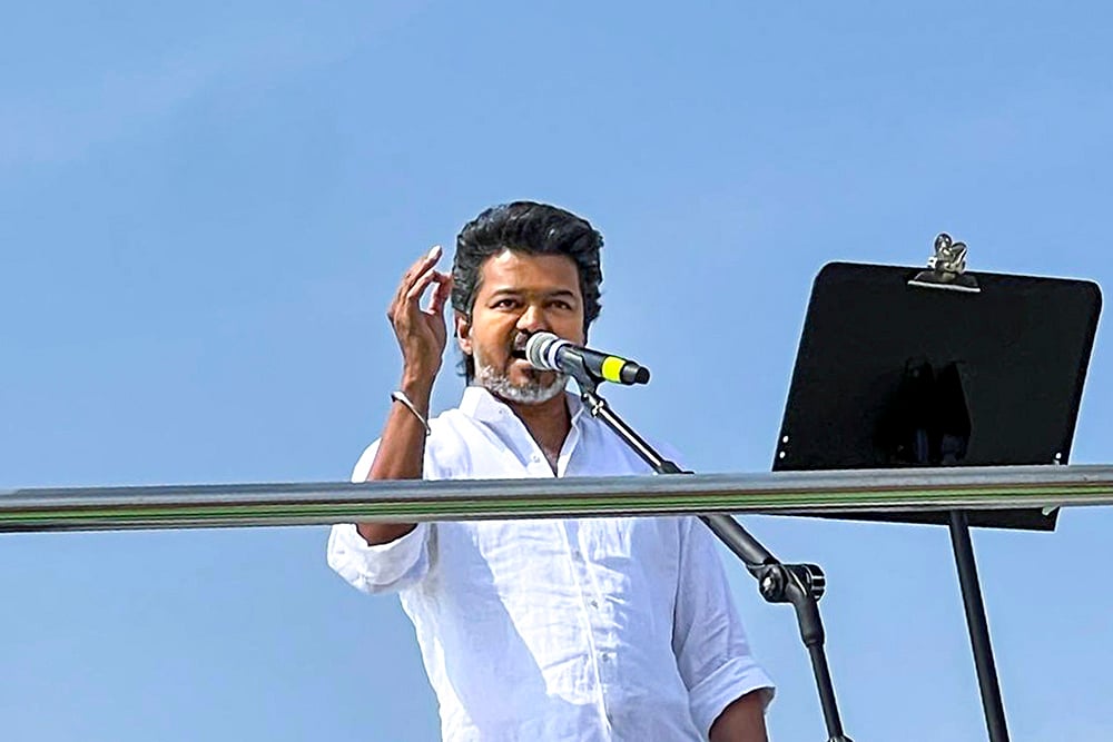 | Photo: PTI : Tamilaga Vettri Kazhagam (TVK) chief Vijay addresses a public meeting, in Erode, Tamil Nadu.