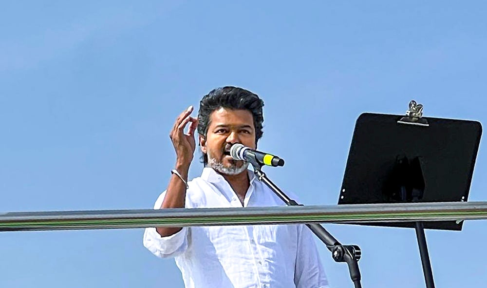| Photo: PTI : Tamilaga Vettri Kazhagam (TVK) chief Vijay addresses a public meeting, in Erode, Tamil Nadu.