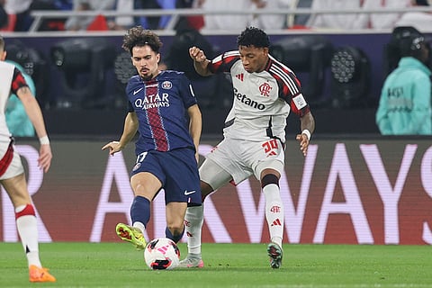 PSG's Vitinha, left, is challenged by Flamengo's Gonzalo Plata during the FIFA Intercontinental Cup final soccer match between Flamengo and Paris Saint-Germain in Doha, Qatar.
