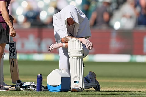 England's captain Ben Stokes takes break during play on day two of the third Ashes cricket test between England and Australia in Adelaide, Australia.