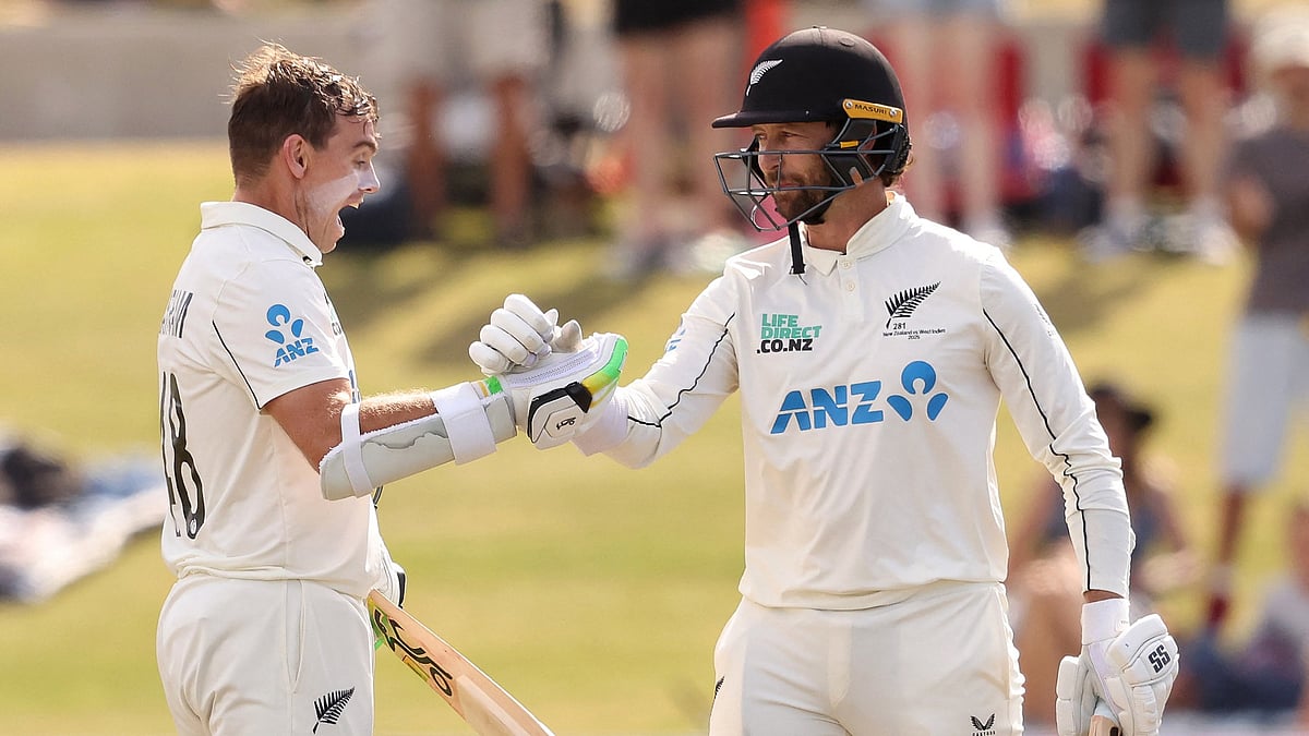 Opta  : Tom Latham (L) celebrates his century with fellow New Zealand opener Devon Conway