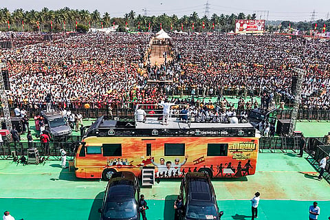 People attend a public meeting of Tamilaga Vettri Kazhagam (TVK) chief Vijay, in Erode, Tamil Nadu.