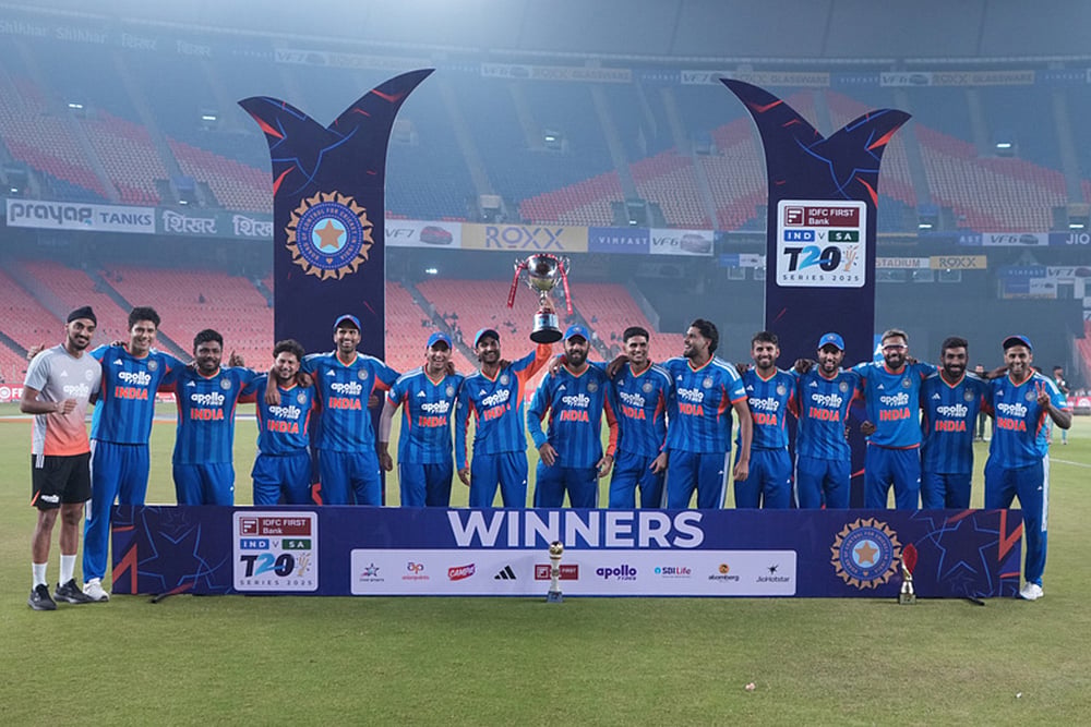 | Photo: AP/Ajit Solanki : Indian players pose with the trophy after winning the fifth T20 cricket match against South Africa in Ahmedabad. India won the series by 3-1.