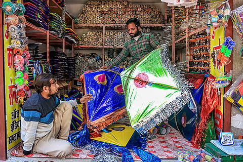 A shopkeeper arranges colourful kites ahead of the upcoming ‘Makar Sankranti’ festival, in Jaipur.