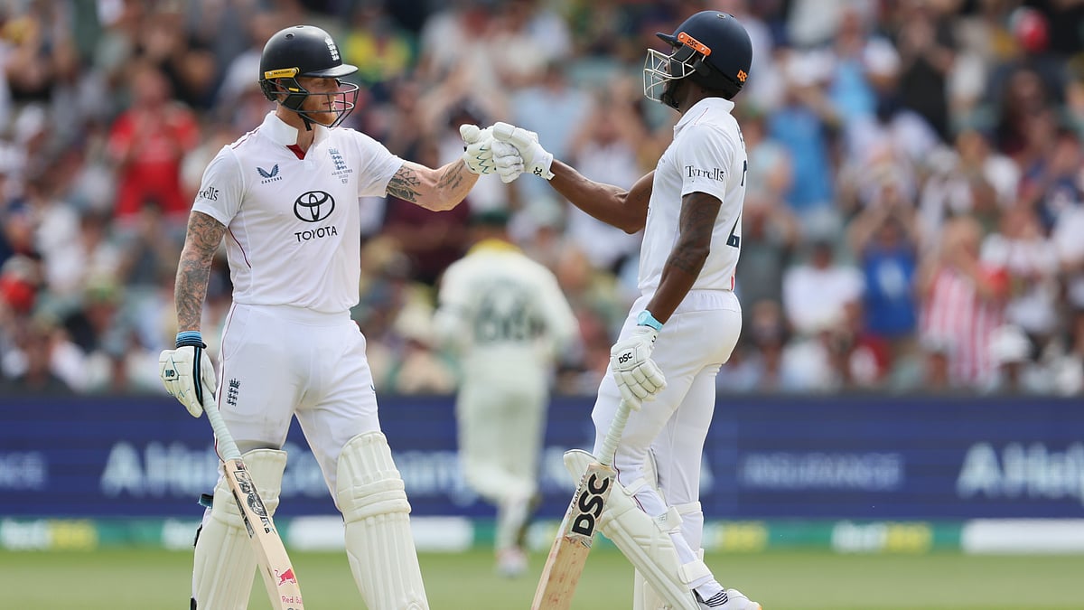 AP :  Jofra Archer, right, and Ben Stokes react during play on day three of the third Ashes cricket Test.