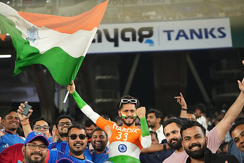 Indian fans cheers before the start of the fifth T20 cricket match between India and South Africa in Ahmedabad.