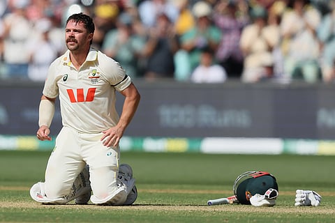 Australia's Travis Head reacts after scoring century during play on day three of the third Ashes cricket test between England and Australia in Adelaide, Australia.