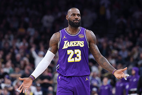 Los Angeles Lakers forward Lebron James (23) reacts after a play against the Utah Jazz during the first half of an NBA basketball game in Salt Lake City. 