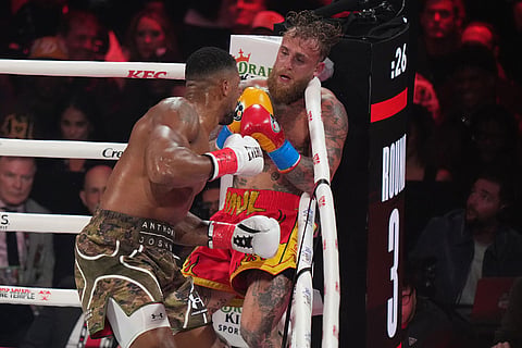Anthony Joshua, left, in action against Jake Paul during their heavyweight boxing match in Miami, Fla.
