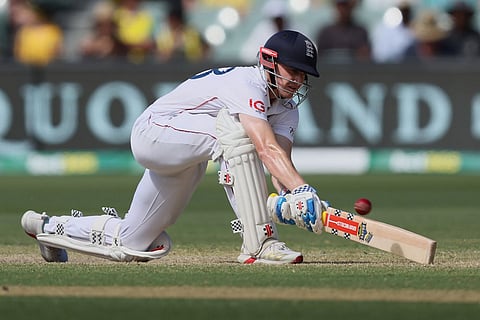 England's Harry Brook plays a sweep shot during play on day four of the third Ashes cricket test between England and Australia in Adelaide, Australia.