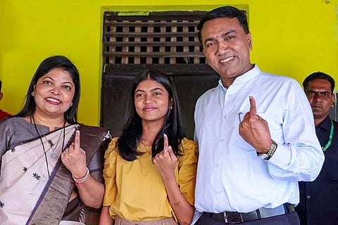 In this image posted on Dec. 20, 2025, Goa Chief Minister Pramod Sawant, right, and his family show their ink-marked finger after casting vote in local body elections, in Goa.