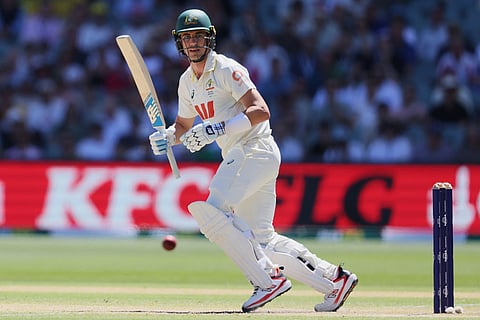 Australia's Pat Cummins bats during play on day four of the third Ashes cricket test between England and Australia in Adelaide, Australia.