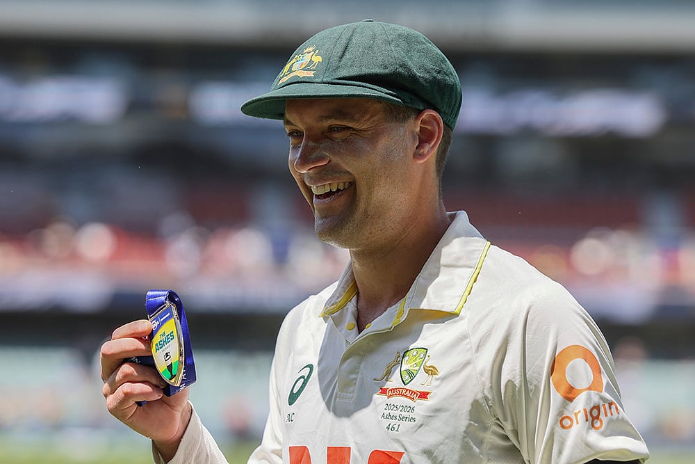 | Photo: AP/James Elsby : Australia's Alex Carey poses with man of the match award after Australia won the third Ashes Test against England in Adelaide, Australia.