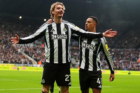 Newcastle's Nick Woltemade, left, celebrates after scoring the opening goal during the English Premier League soccer match between Newcastle United and FC Chelsea in Newcastle, England.