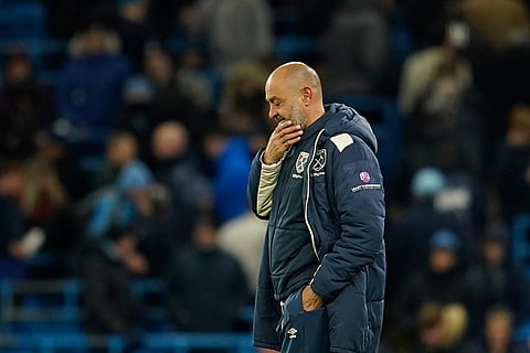 West Ham's head coach Nuno Espírito Santo walks on the pitch after the end of the English Premier League soccer match between Manchester City and West Ham United in Manchester, England.