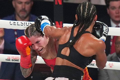 Lela Beaudoin, left, and Alycia Baumgardner, right, compete during their super-featherweight fight in Miami.