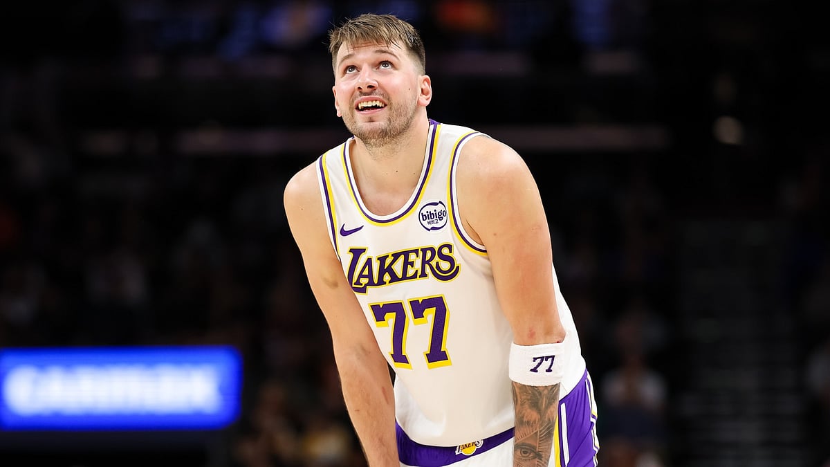 Luka Doncic #77 of the Los Angeles Lakers looks on during the second half of a game against the Phoenix Suns at Mortgage Matchup Center on December 14, 2025 in Phoenix, Arizona.