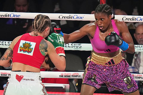 Camila Panatta, left, and Caroline Dubois compete during their WBC lightweight world title fight in Miami.