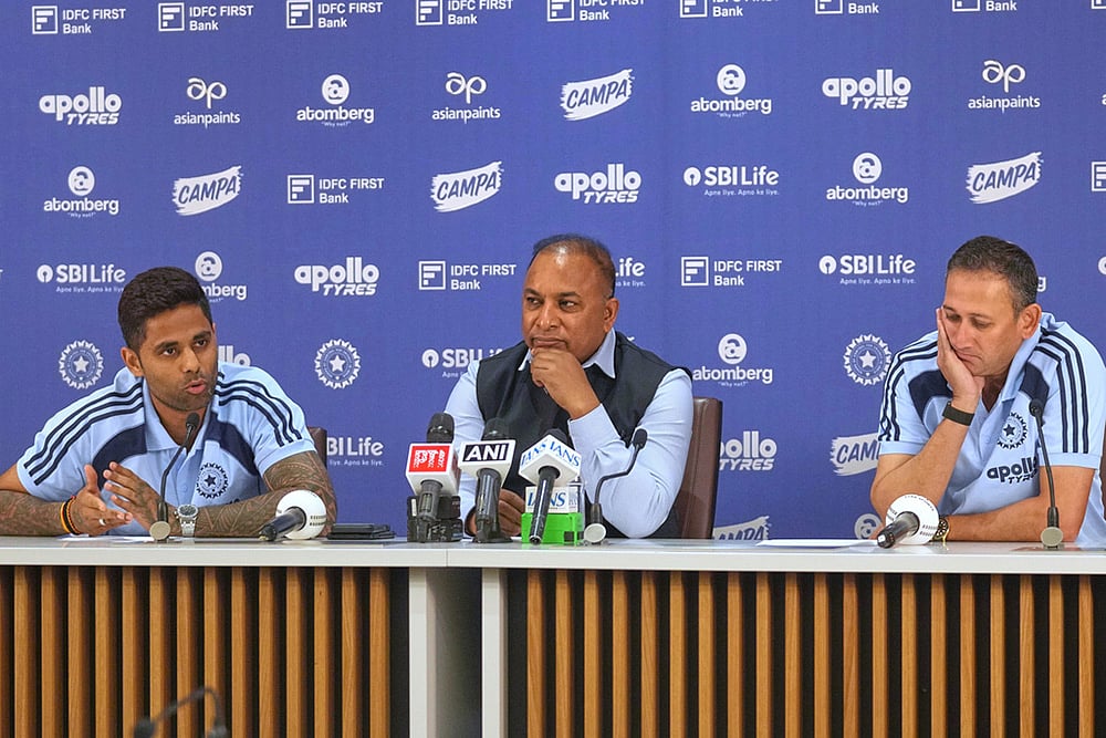 | Photo: AP/Rafiq Maqbool : Indian Mens T20 Captain Suryakumar Yadav, left, speaks as Board of Control for Cricket in India (BCCI) Secretary Devajit Saikia , centre, and Chief Selector Ajit Agarkar look on during a press conference for India's squad announcement for the ICC Men's T20 World Cup 2026 at BCCI headquarter in Mumbai.