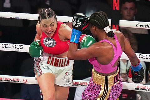 Camila Panatta, left, and Caroline Dubois compete during their WBC lightweight world title fight in Miami.