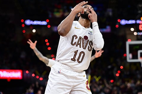 Cleveland Cavaliers guard Darius Garland celebrates after making a three-point basket in the second half of an NBA basketball game against the Chicago Bulls in Cleveland. 
