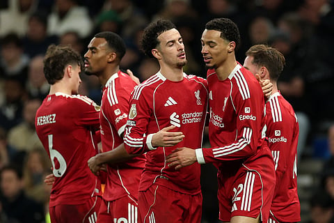 Liverpool's Hugo Ekitike, front right, celebrates with teammates after scoring his side's second goal during the English Premier League soccer match between Tottenham and Liverpool in London.