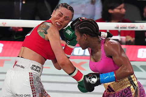 Camila Panatta, left, and Caroline Dubois, right, compete during their WBC lightweight world title fight in Miami.