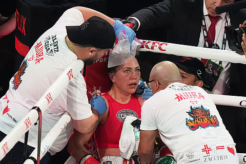 Camila Panatta has ice applied during her WBC lightweight world title fight against Caroline Dubois in Miami.