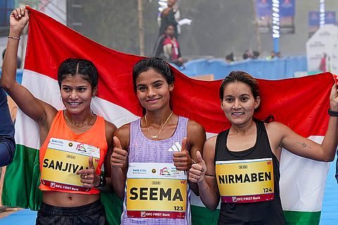 From left, silver medallist India’s Sanjivani Jadhav with compatriots gold medallist Seema and bronze medallist Nirmaben Thakor after the Indian women’s elite category race at the ‘10th Tata Steel Kolkata 25K’ event, in Kolkata, West Bengal. Seema broke the course record in the category. 