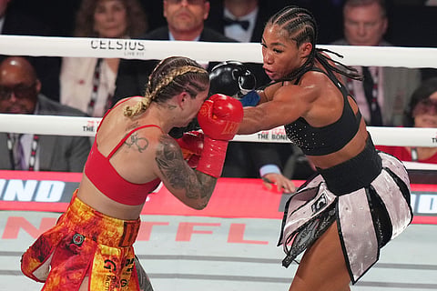 Lela Beaudoin, left, and Alycia Baumgardner, right, compete during their super-featherweight fight in Miami.