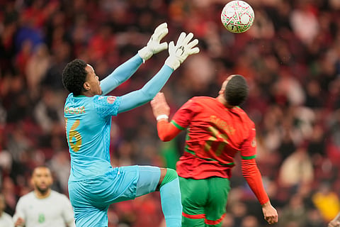 Comoros' goalkeeper Yannick Marc Ahmed Pandor catches the ball during the Africa Cup of Nations group A soccer match between Morocco and Comoros in Rabat, Morocco.
