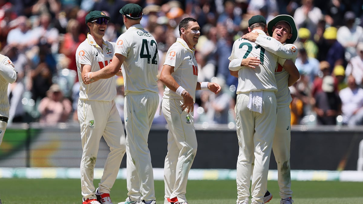 | Photo: AP/James Elsby : Australia's players celebrate after winning the third Ashes Test against England in Adelaide, Australia, Sunday, Dec. 21, 2025. 