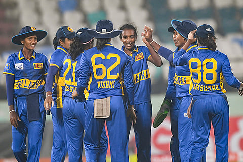 Sri Lanka's Kawya Kavindi celebrates with teammates after taking wicket of India's Shafali Verma during the first Women's T20I cricket match between India and Sri Lanka, in Visakhapatnam, Andhra Pradesh.