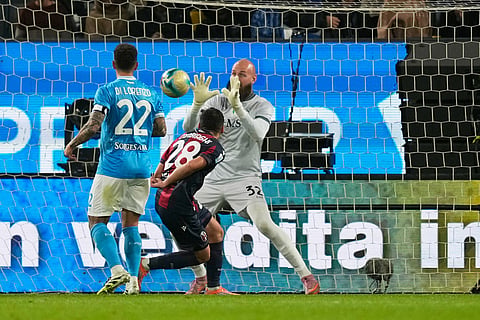 Napoli's Vanja Milinkovic-Savic, center, saves the ball during the Italian Super Cup final soccer match between Napoli and Bologna in Riyadh, Saudi Arabia.