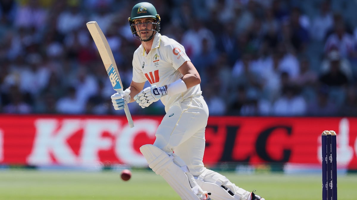 | Photo: AP/James Elsby : Australia's Pat Cummins bats during play on day four of the third Ashes cricket test between England and Australia in Adelaide, Australia, Saturday, Dec. 20, 2025. 