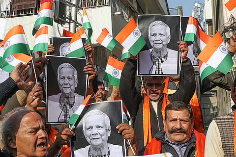 Shiv Sena members hold portraits of Bangladesh Chief Adviser Muhammad Yunus during a protest against alleged violence and killings of Hindus in Bangladesh, in Jammu.