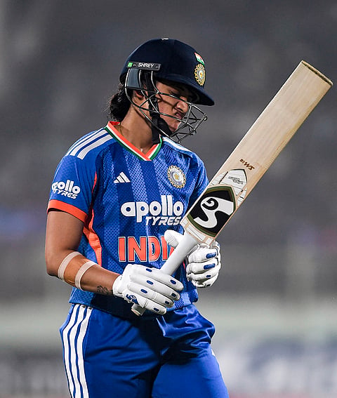 India's Smriti Mandhana walks off the field after her dismissal during the second T20I cricket match between India and Sri Lanka, in Visakhapatnam, Andhra Pradesh.