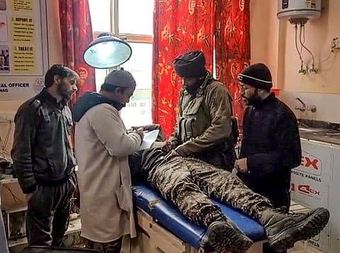 Injured CRPF personnel being provided medical assistance after a leopard entered the premises and attacked during breakfast hours, in Kapran area, Anantnag.