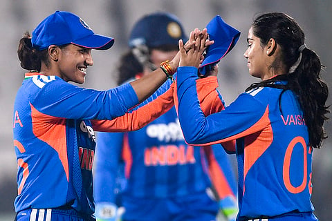 India's Vaishnavi Sharma, right, celebrates with teammate Sneh Rana after taking a wicket during the second T20I cricket match between India and Sri Lanka, in Visakhapatnam, Andhra Pradesh.