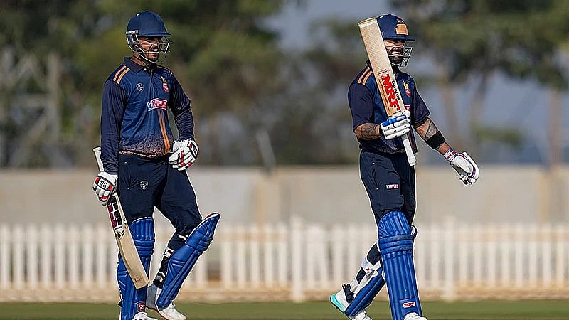 PTI : Virat Kohli, right, celebrates his century during the Vijay Hazare Trophy 2025-26 cricket match between Andhra and Delhi, at BCCI Centre of Excellence Ground, in Bengaluru.