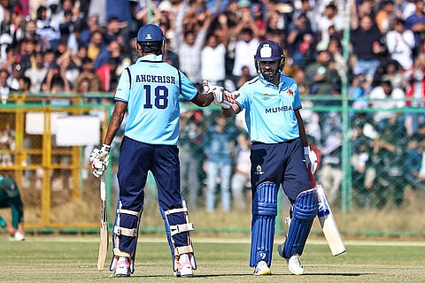 Mumbai's Rohit Sharma, right, and Angkrish Raghuvanshi greet each other during the Vijay Hazare Trophy 2025-26 cricket match between Mumbai and Sikkim, at Sawai Mansingh Stadium, in Jaipur.