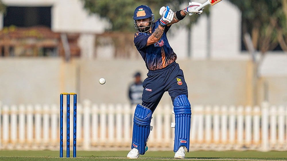 Photo: PTI/Shailendra Bhojak : Delhi's Virat Kohli plays a shot during the Vijay Hazare Trophy 2025-26 cricket match between Andhra and Delhi, at BCCI Centre of Excellence Ground, in Bengaluru.